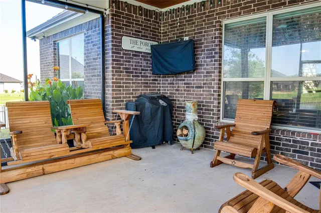 a bench is sitting in front of a house