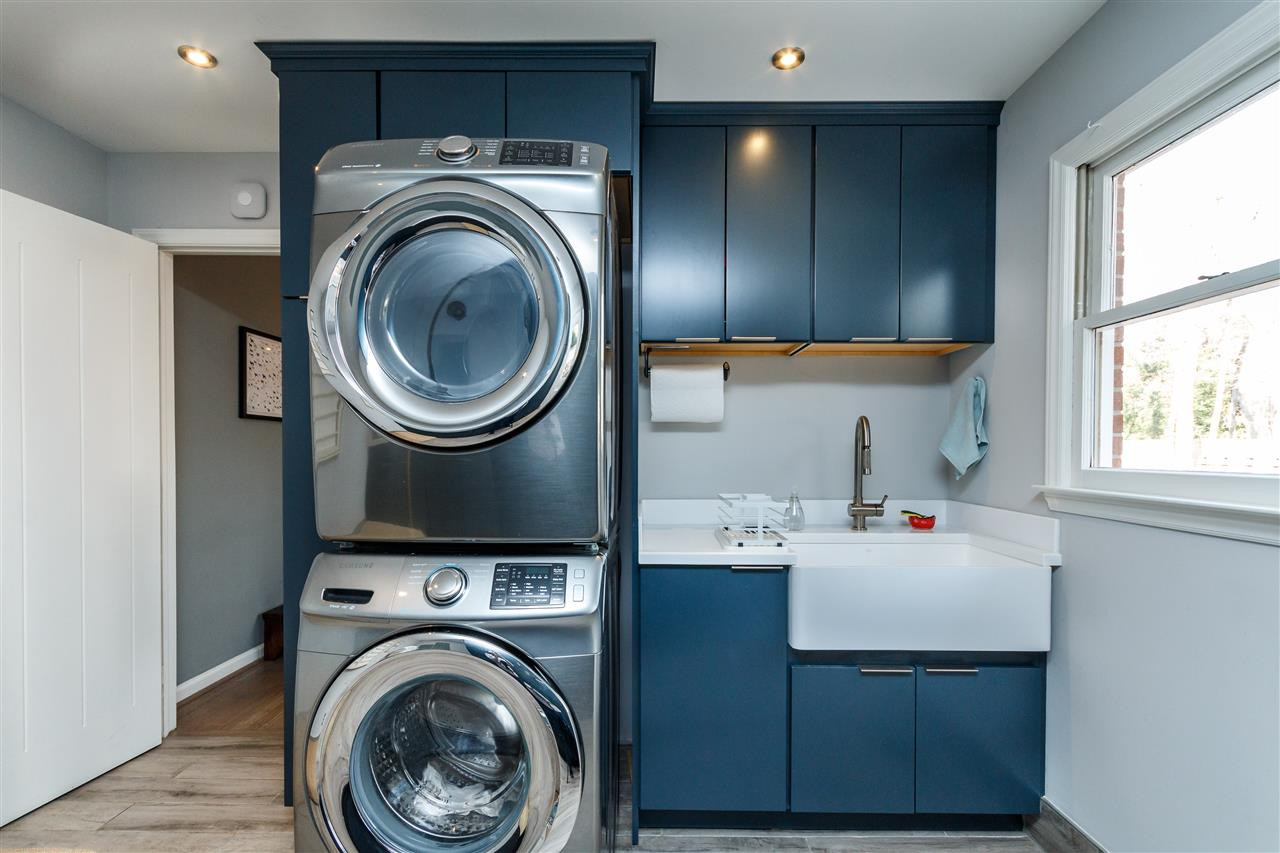 3412 1st Place Raleigh, NC 27613 - Photo 12 of 25 Brilliant white Farmhouse sink. Space for stackable washer and dryer and plumbing for both an electric or gas powered drier. Laundry Room