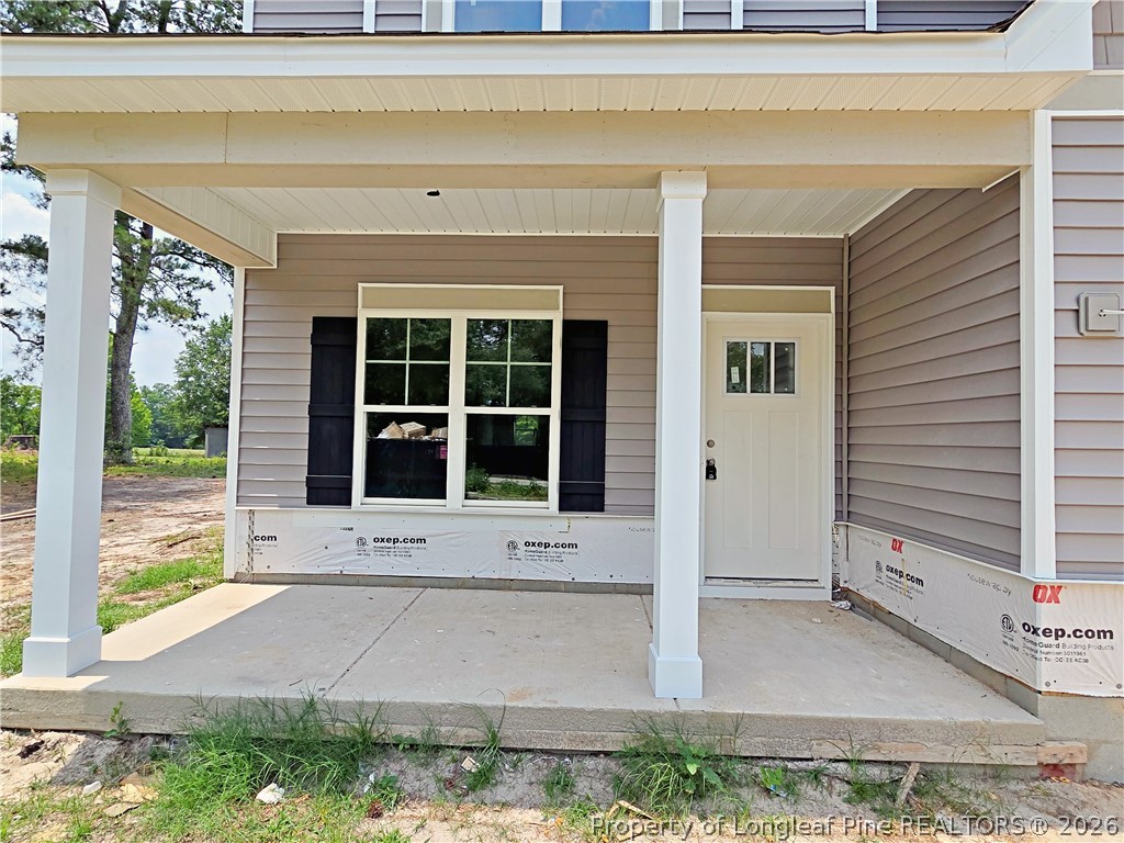 2678 Norrington Road Lillington, NC 27546 - Photo 2 of 31 a front view of a house with a yard