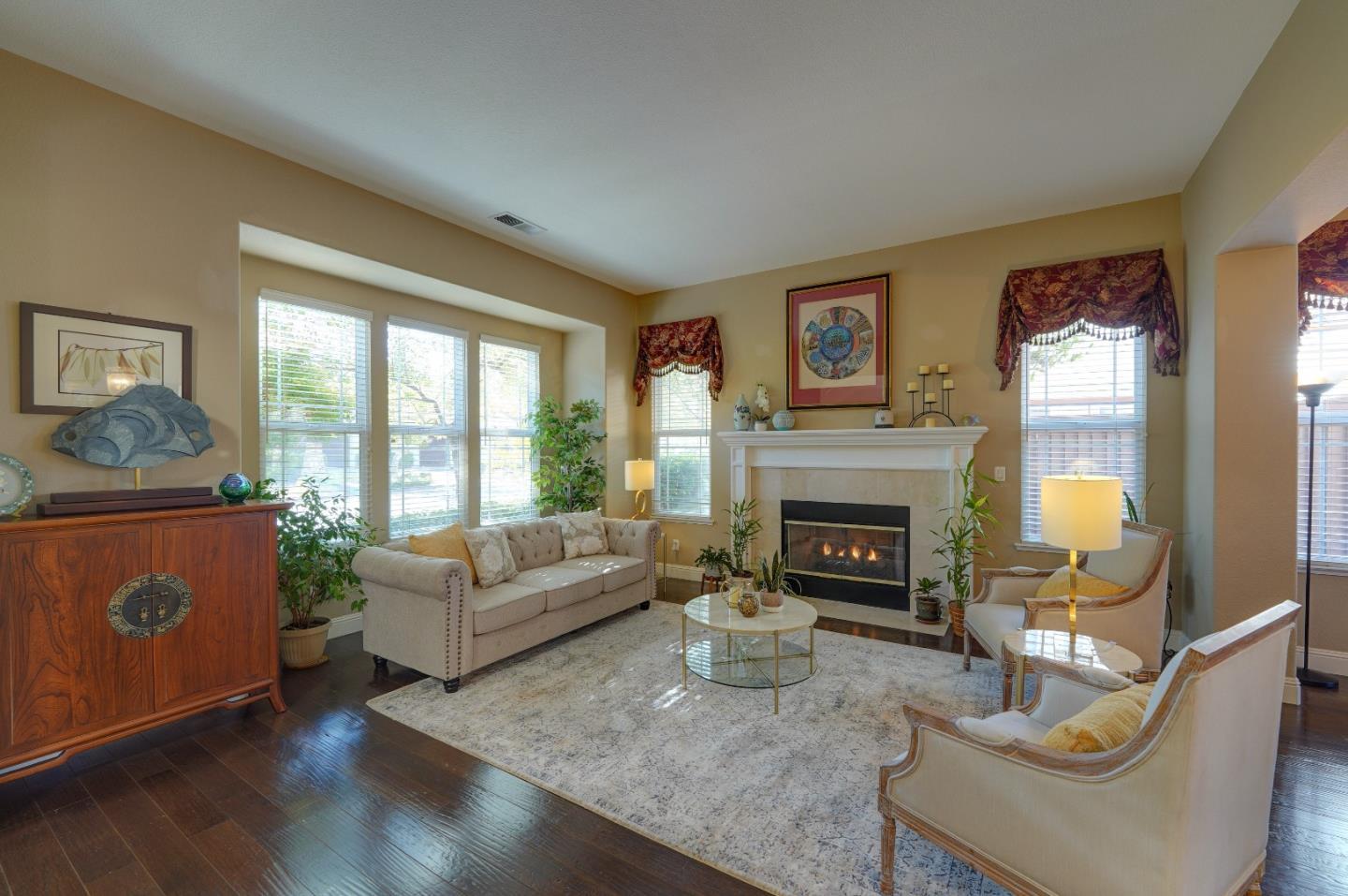 2400 Club Drive Gilroy, CA 95020 - Photo 12 of 67 a living room with furniture a window and a fireplace