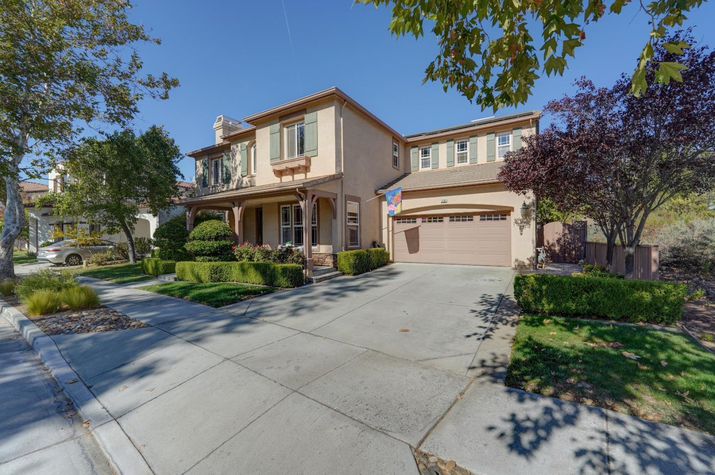 2400 Club Drive Gilroy, CA 95020 - Photo 2 of 67 a view of a white house with a yard and plants