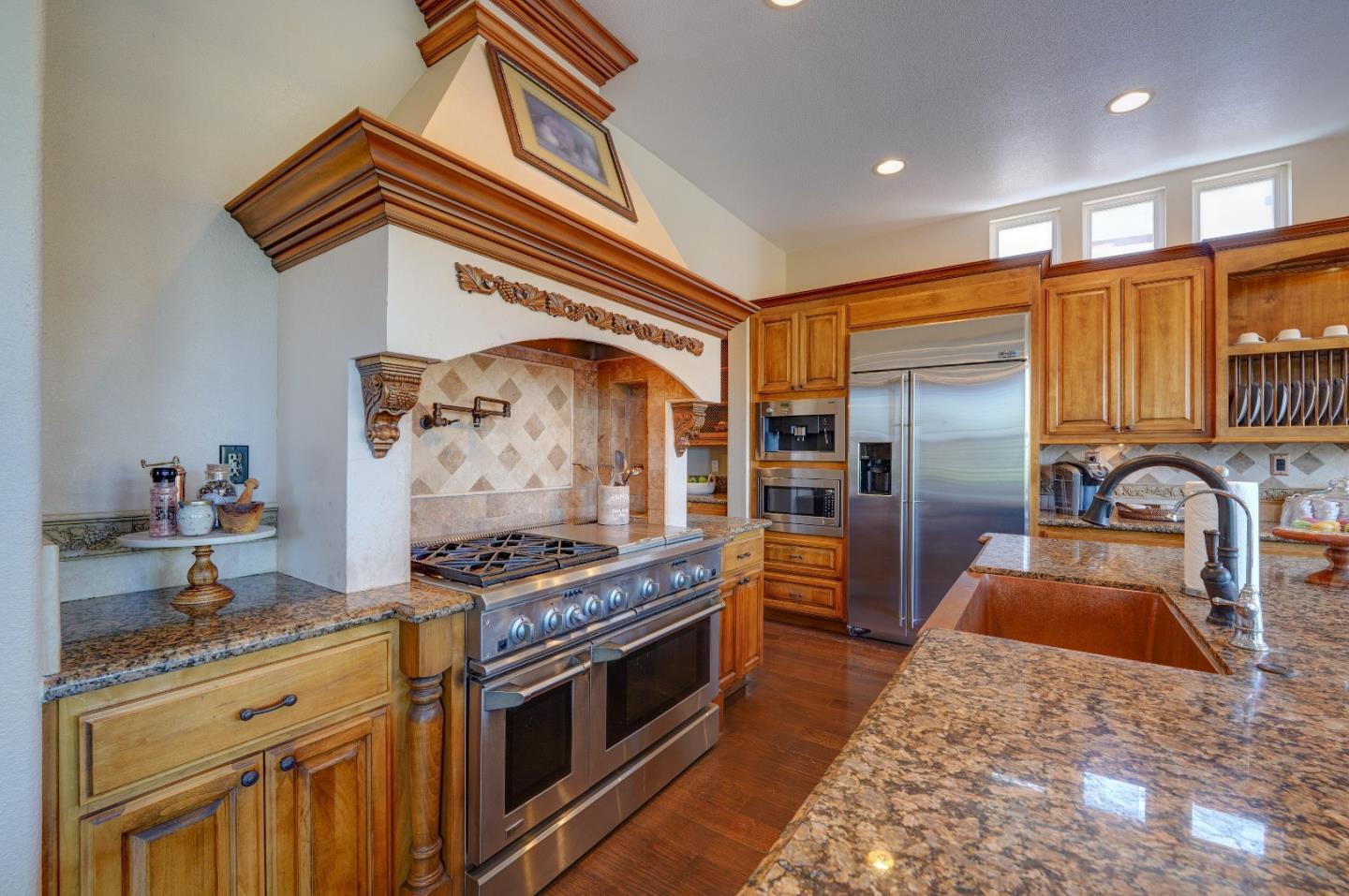 2400 Club Drive Gilroy, CA 95020 - Photo 21 of 67 a kitchen with stainless steel appliances granite countertop a stove a sink and a refrigerator