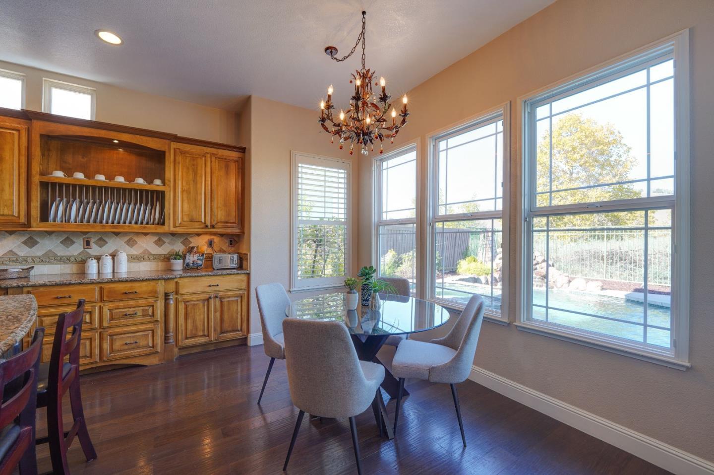 2400 Club Drive Gilroy, CA 95020 - Photo 22 of 67 a view of a dining room with furniture window and wooden floor