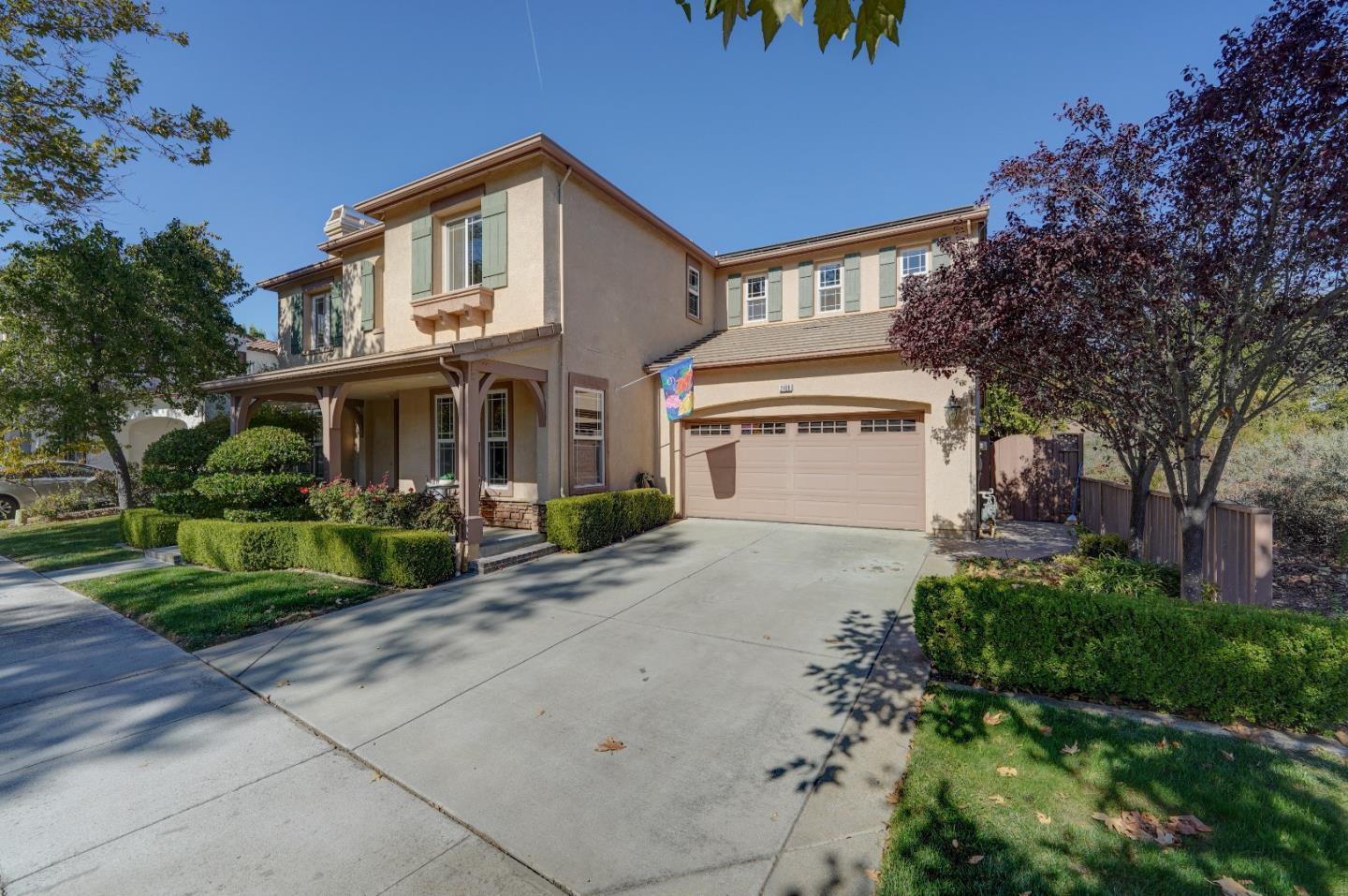 2400 Club Drive Gilroy, CA 95020 - Photo 3 of 67 a front view of a house with a yard and garage