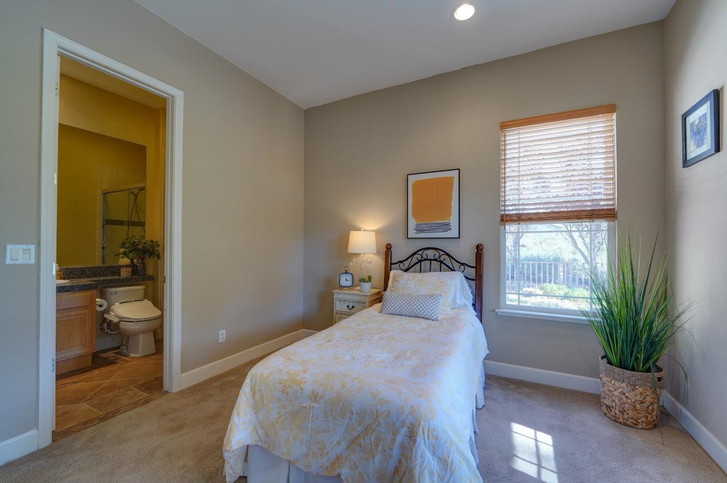 2400 Club Drive Gilroy, CA 95020 - Photo 32 of 67 a bedroom with a bed and a potted plant