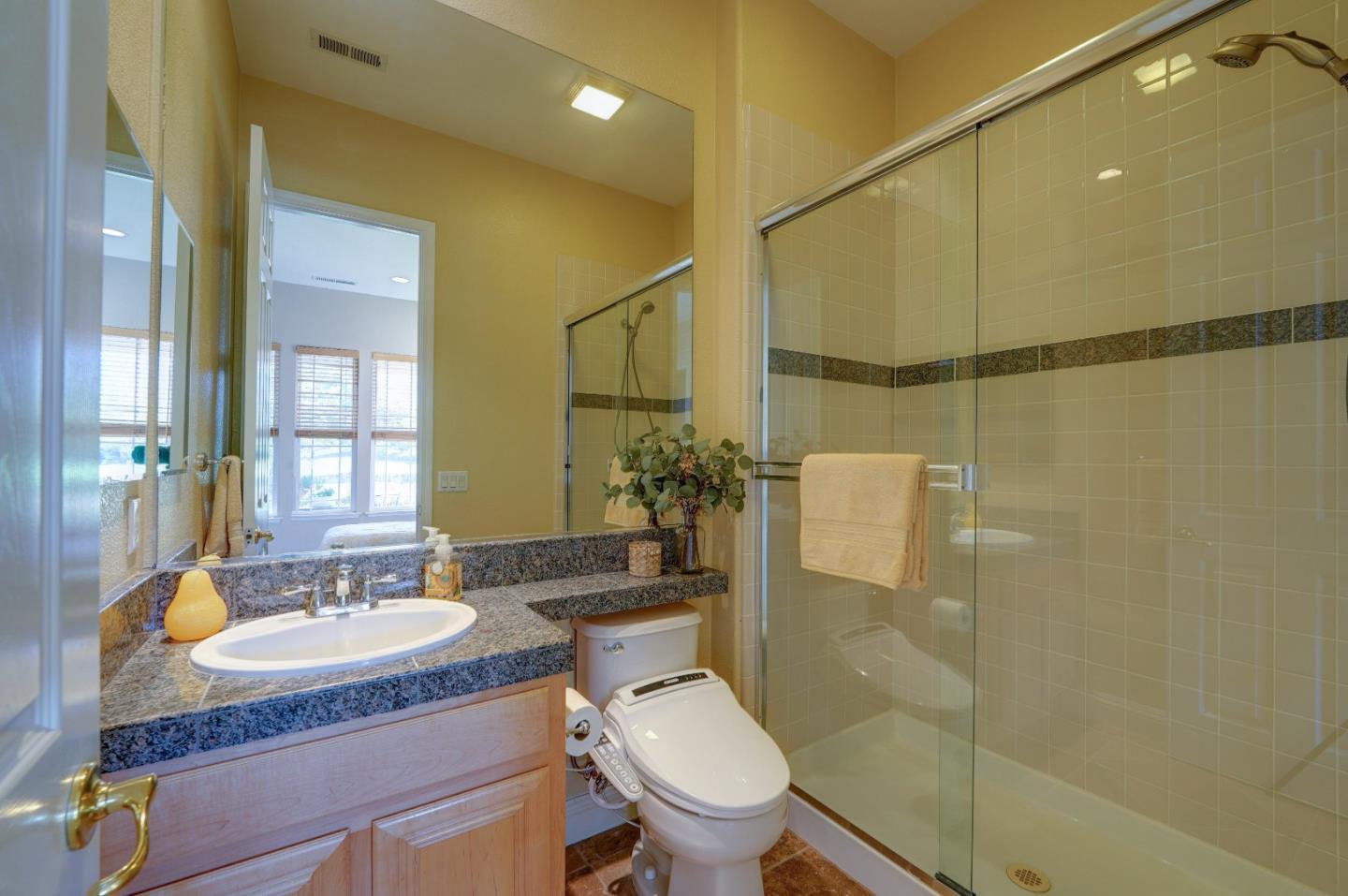 2400 Club Drive Gilroy, CA 95020 - Photo 33 of 67 a bathroom with a granite countertop sink toilet and shower