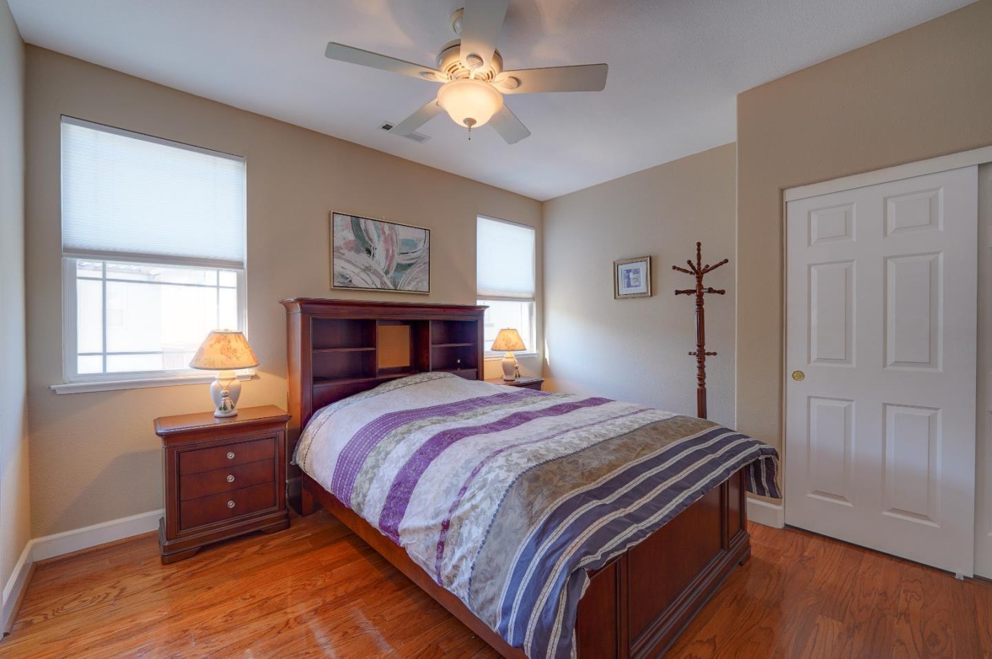 2400 Club Drive Gilroy, CA 95020 - Photo 35 of 67 a bedroom with a bed and a chandelier