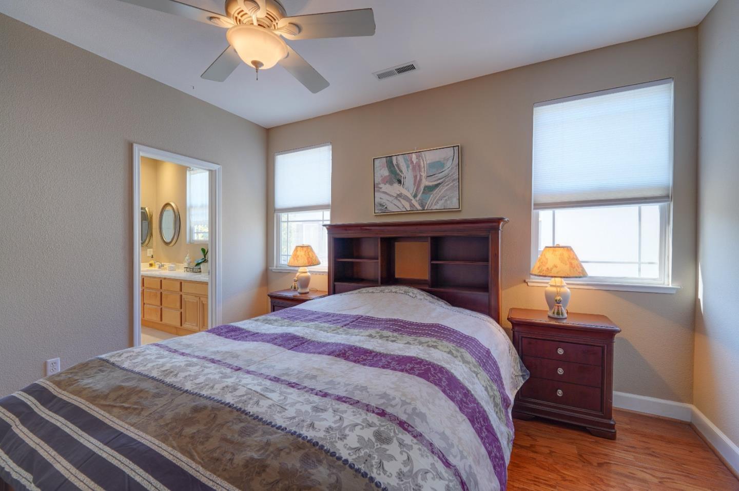 2400 Club Drive Gilroy, CA 95020 - Photo 36 of 67 a bedroom with a bed and a chandelier