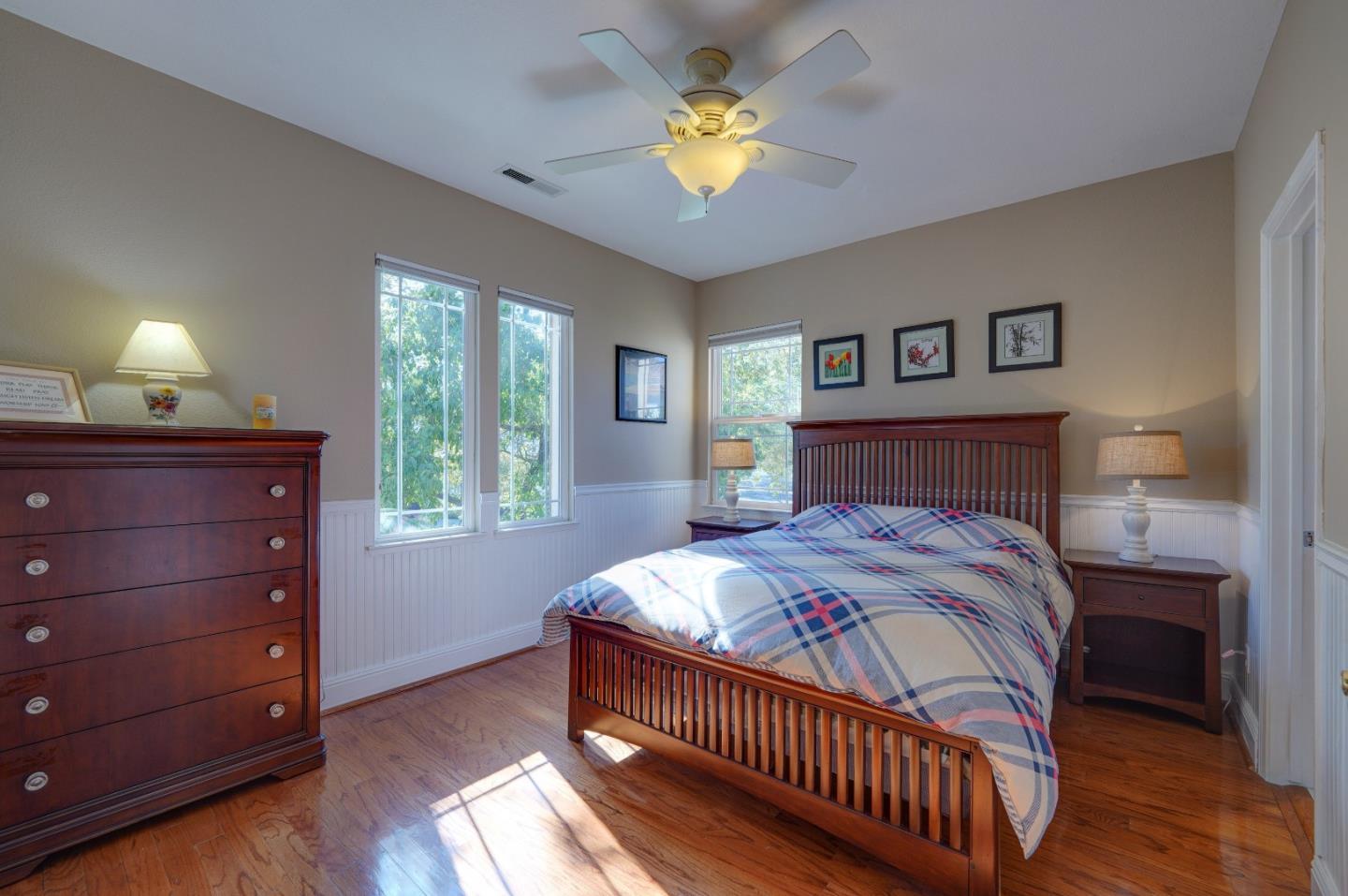 2400 Club Drive Gilroy, CA 95020 - Photo 39 of 67 a bedroom with a bed and a chandelier
