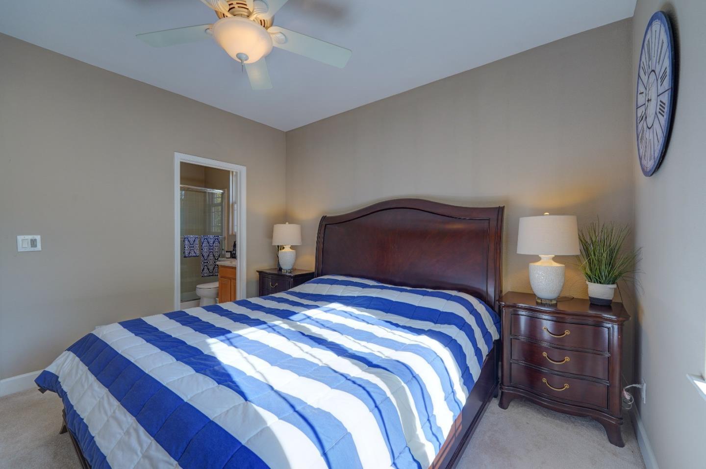 2400 Club Drive Gilroy, CA 95020 - Photo 42 of 67 a bedroom with a bed and a chandelier