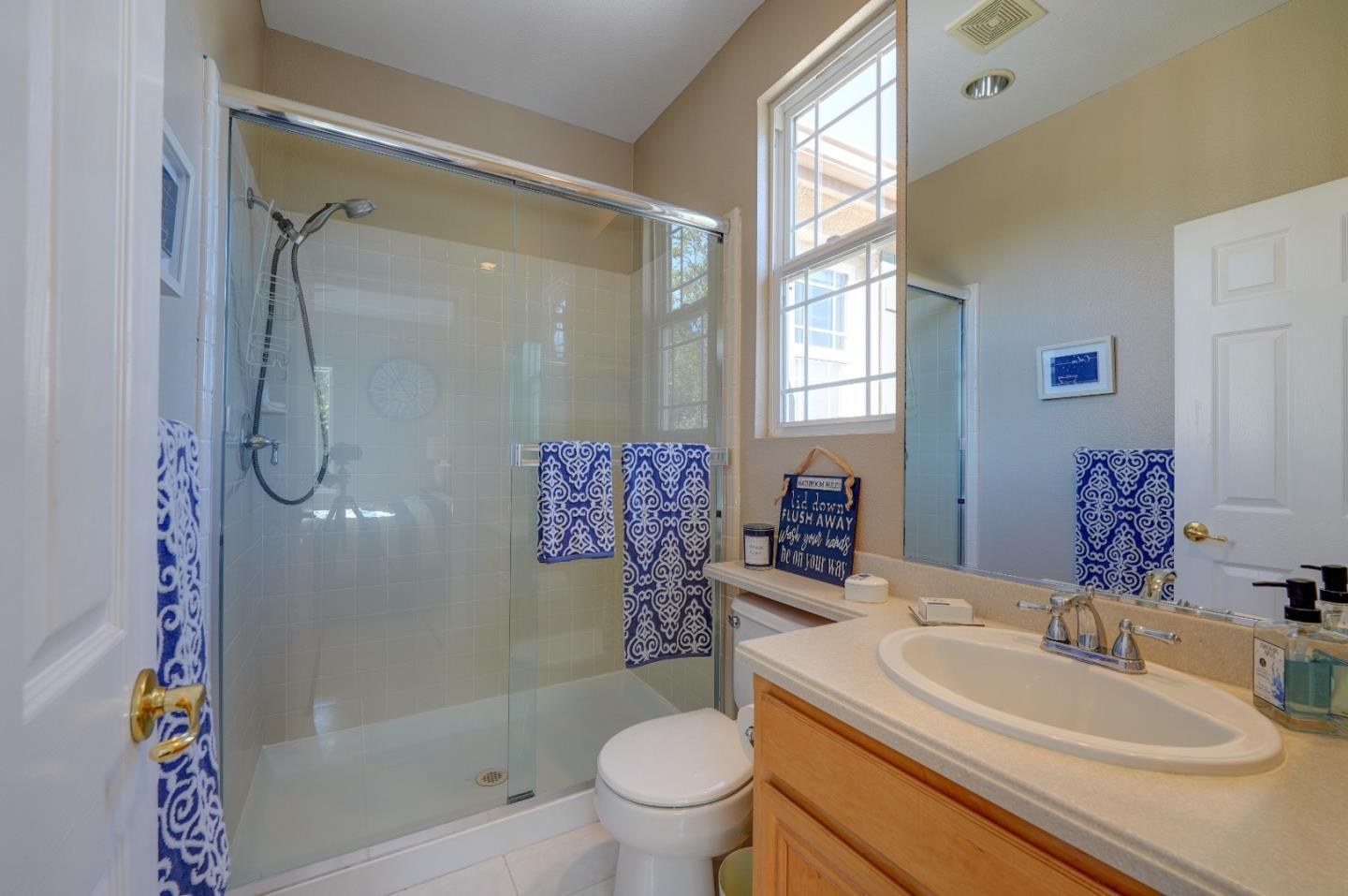 2400 Club Drive Gilroy, CA 95020 - Photo 43 of 67 a bathroom with a sink a toilet and shower