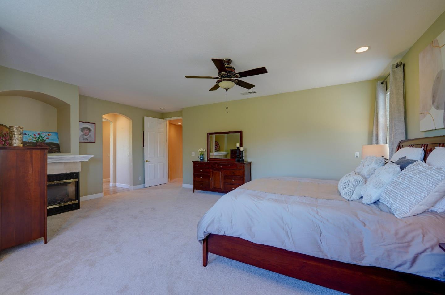 2400 Club Drive Gilroy, CA 95020 - Photo 49 of 67 a bedroom with a bed and a chandelier