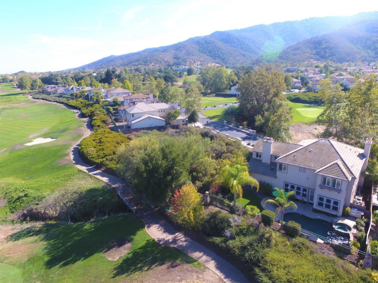 2400 Club Drive Gilroy, CA 95020 - Photo 63 of 67 an aerial view of a house with garden space and mountain view in back