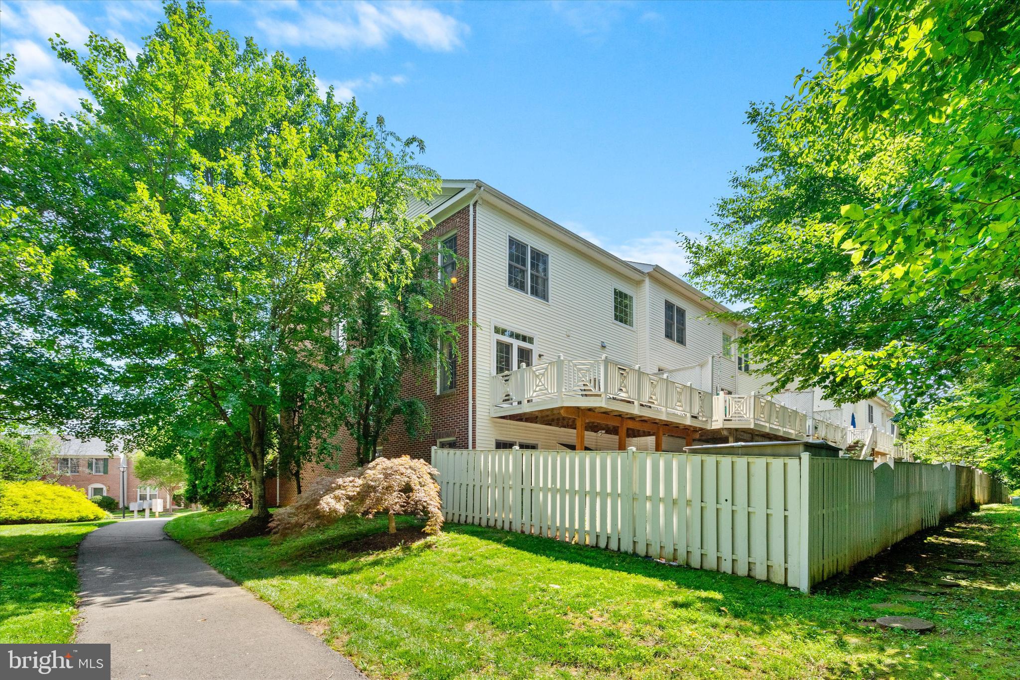 8512 Bells Ridge Terrace Potomac, MD 20854 - Photo 16 of 45 a view of a house with a yard and plants