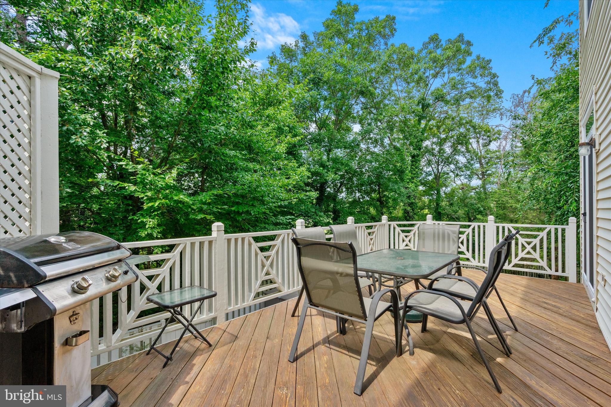 8512 Bells Ridge Terrace Potomac, MD 20854 - Photo 17 of 45 a view of a table and chairs in the roof deck