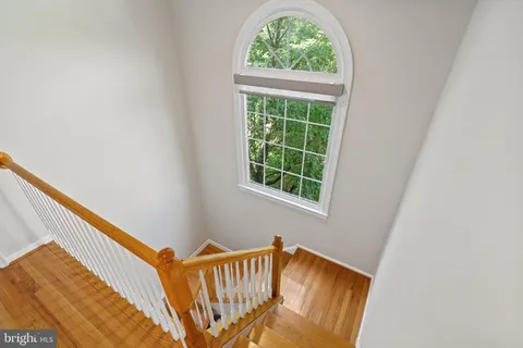 a bedroom with a bed chair and a window