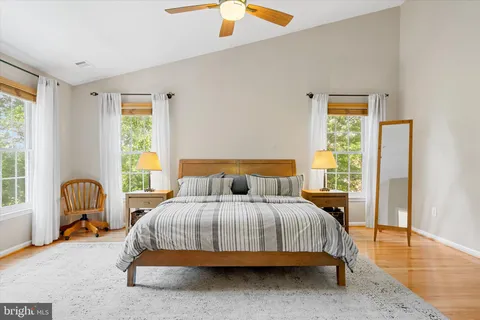 a bedroom with a bed closet and flat screen tv