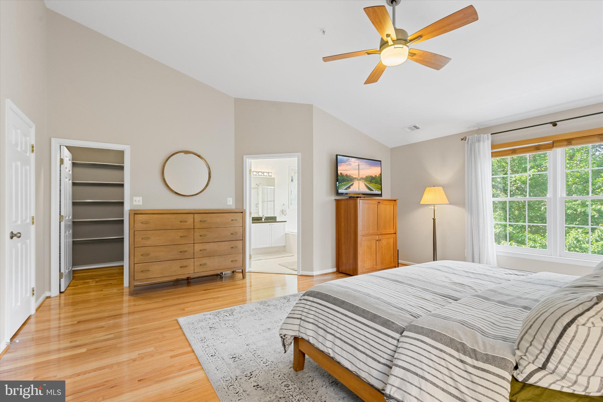 8512 Bells Ridge Terrace Potomac, MD 20854 - Photo 20 of 45 a bedroom with a bed closet and flat screen tv