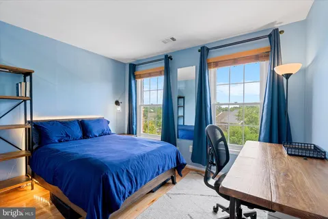 a bedroom with a bed and a table