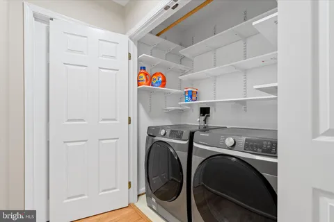a bathroom with a toilet a sink and a mirror