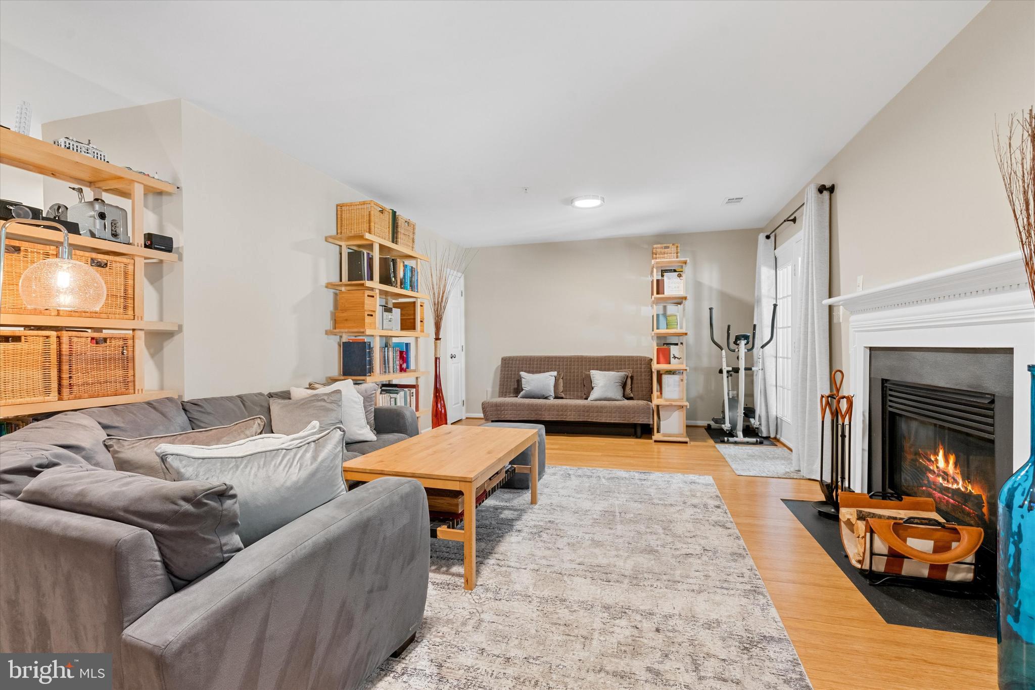 8512 Bells Ridge Terrace Potomac, MD 20854 - Photo 29 of 45 a living room with furniture and a fireplace