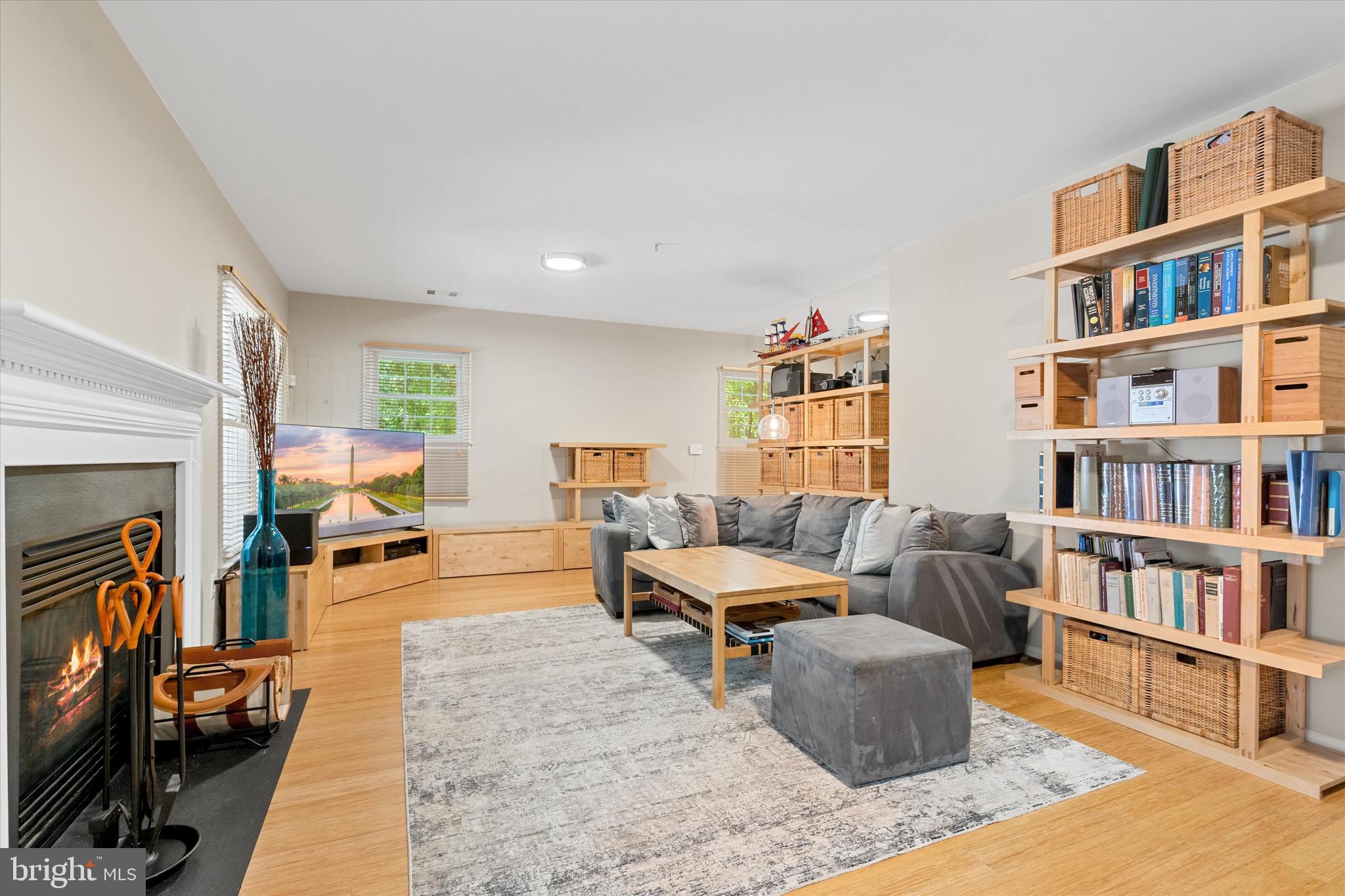 8512 Bells Ridge Terrace Potomac, MD 20854 - Photo 32 of 45 a living room with furniture and a book shelf