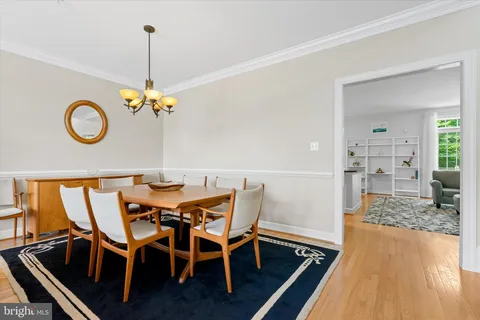 a large kitchen with granite countertop a large counter top stainless steel appliances and cabinets