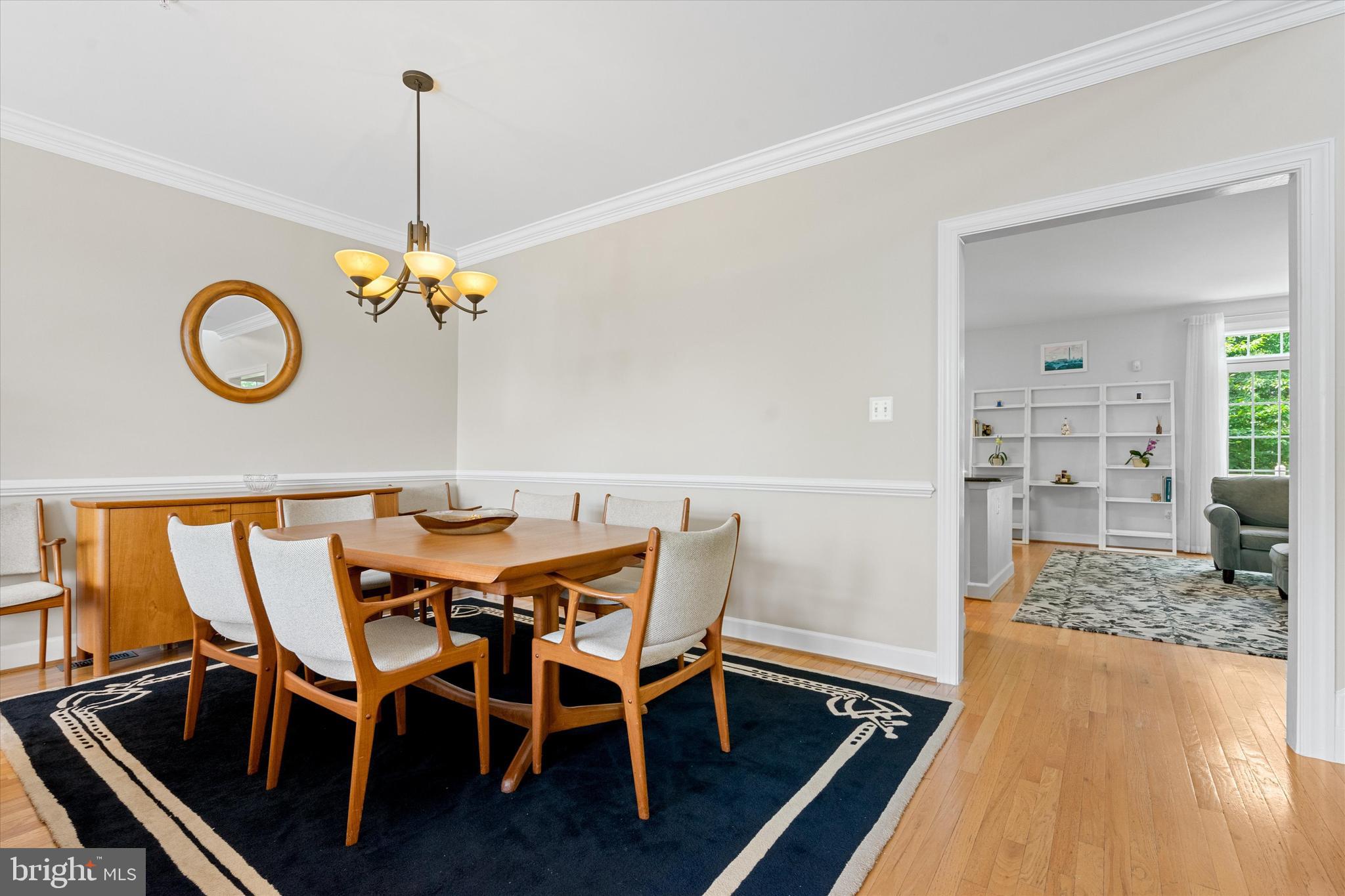 8512 Bells Ridge Terrace Potomac, MD 20854 - Photo 8 of 45 a view of a dining room with furniture and chandelier