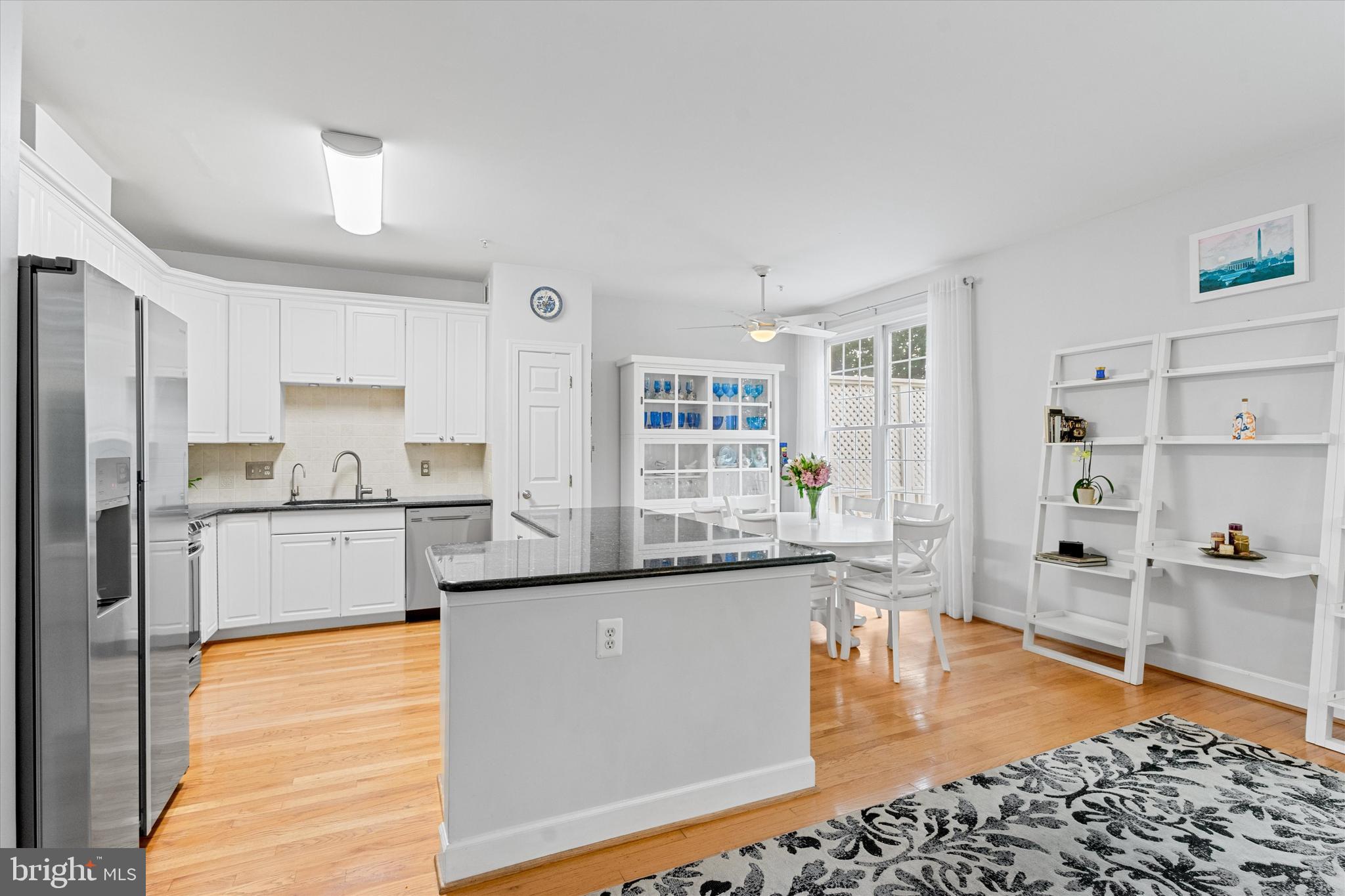 8512 Bells Ridge Terrace Potomac, MD 20854 - Photo 9 of 45 a large kitchen with granite countertop a large counter top stainless steel appliances and cabinets