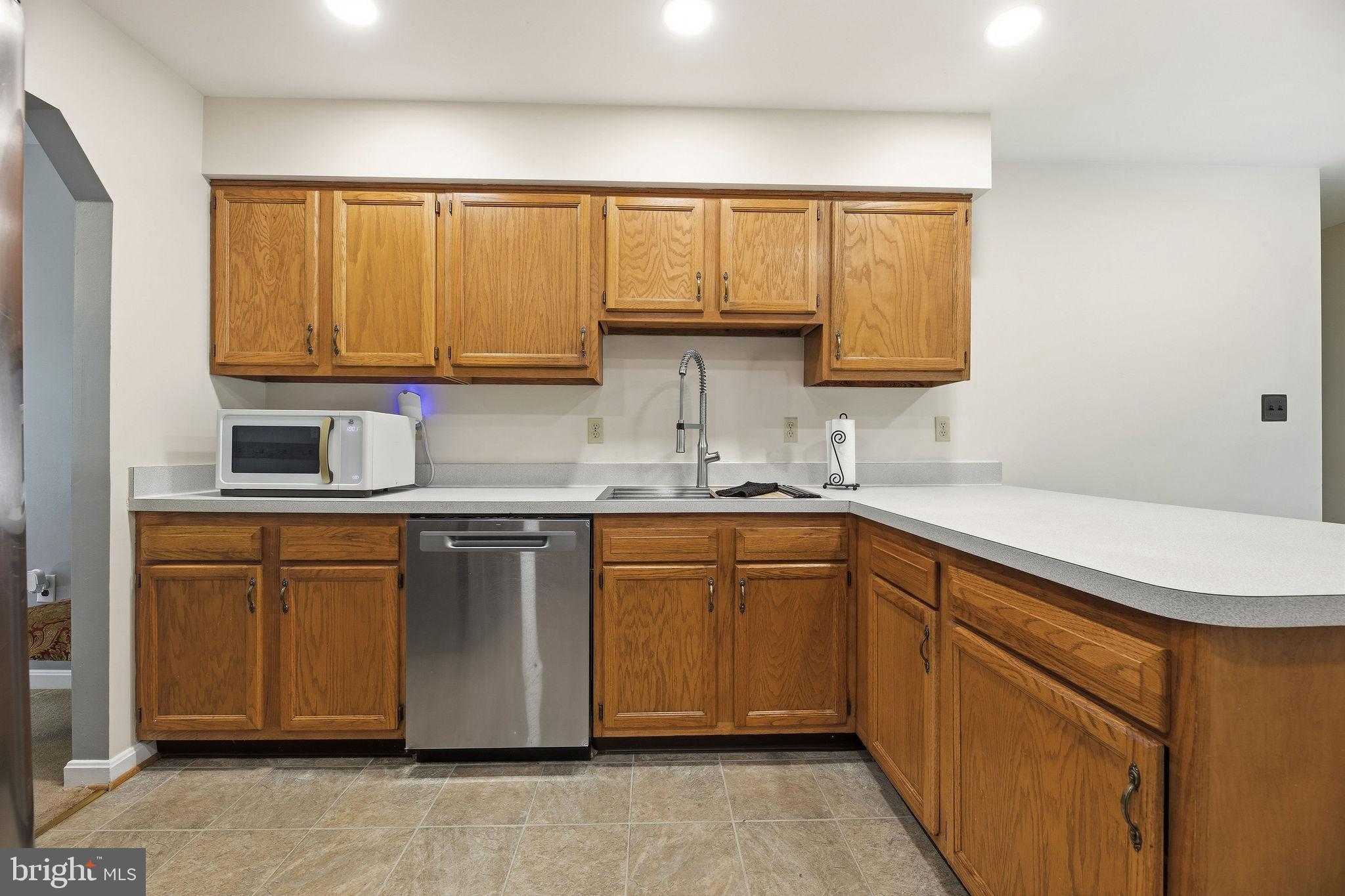 1040 Redeye Road Lusby, MD 20657 - Photo 11 of 51 Stainless appliances and great newer farm sink