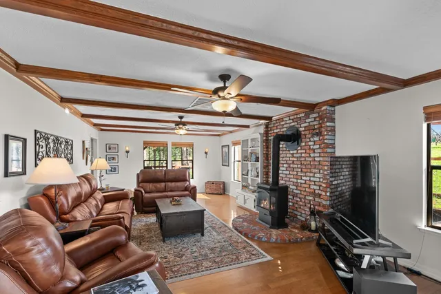 a view of a balcony with furniture and wooden floor