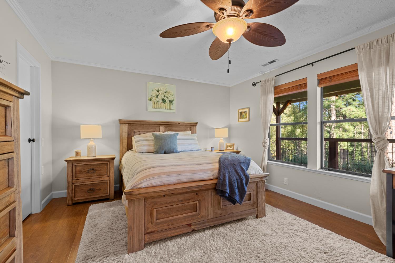 17476 Fiddletown Road Fiddletown, CA 95629 - Photo 21 of 82 a bedroom with a large bed and a large window