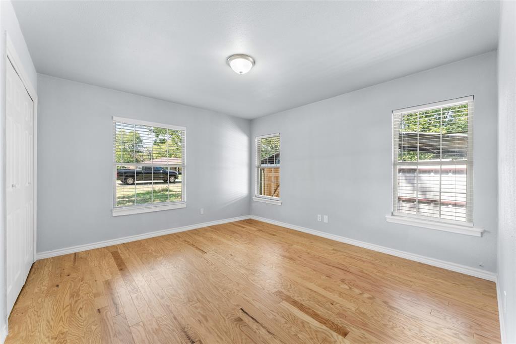 612 East 8th Street Kemp, TX 75143 - Photo 15 of 27 a view of an empty room with wooden floor and a window