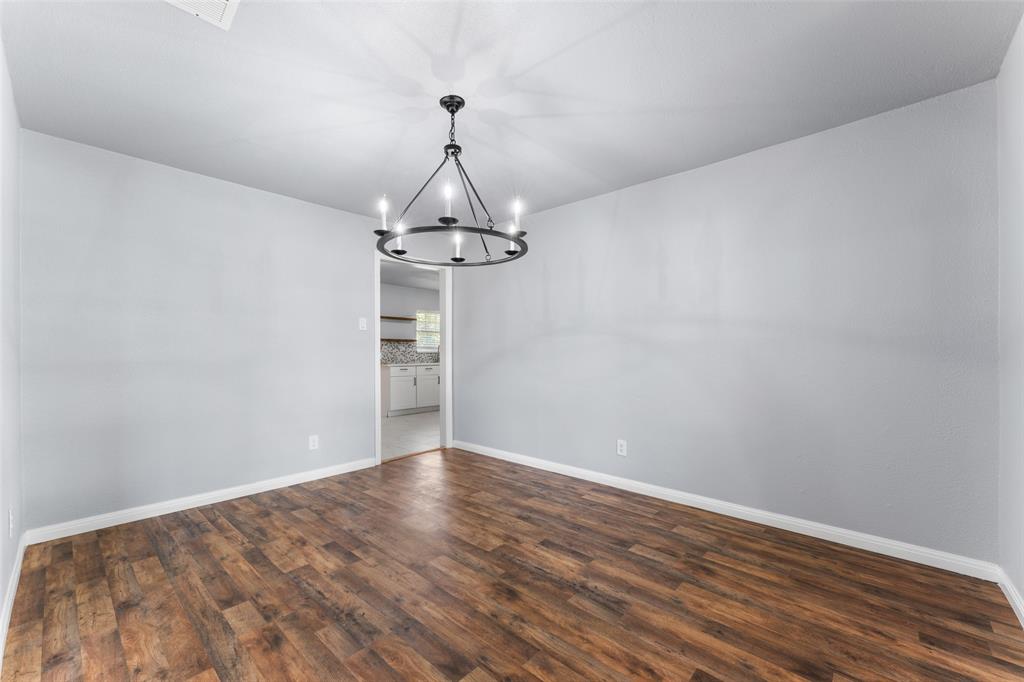 612 East 8th Street Kemp, TX 75143 - Photo 27 of 27 a view of a room with wooden floor and ceiling fan