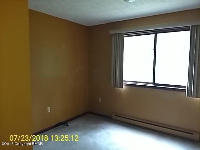 263 Canterbury Road Bushkill, PA 18324 - Photo 11 of 16 a view of an empty room with a window