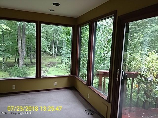 263 Canterbury Road Bushkill, PA 18324 - Photo 12 of 16 a view of an empty room with large windows