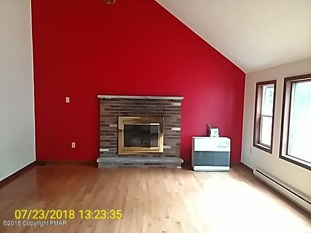 263 Canterbury Road Bushkill, PA 18324 - Photo 3 of 16 a living room with furniture and a fireplace