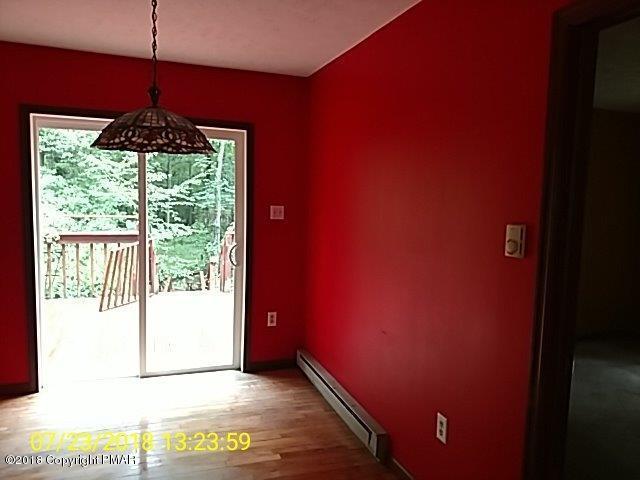 263 Canterbury Road Bushkill, PA 18324 - Photo 5 of 16 a view of an empty room and window