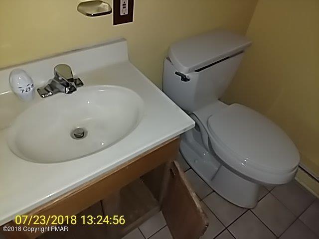 263 Canterbury Road Bushkill, PA 18324 - Photo 10 of 16 a bathroom with a sink and a toilet