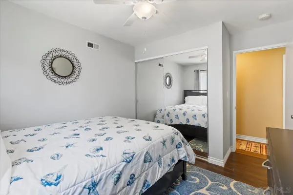 a white toilet sitting next to a shower curtain