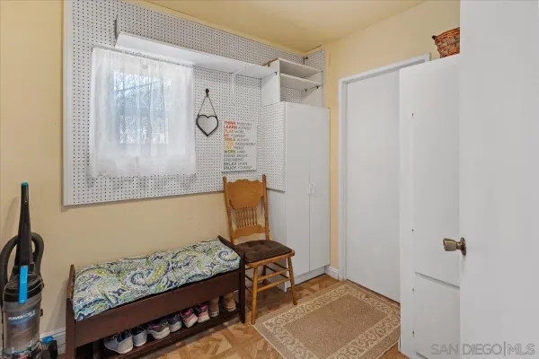 a utility room with cabinets washer and dryer