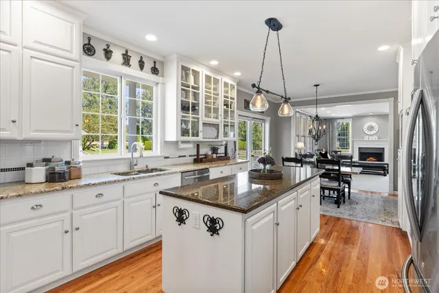 a kitchen with sink stove and cabinets