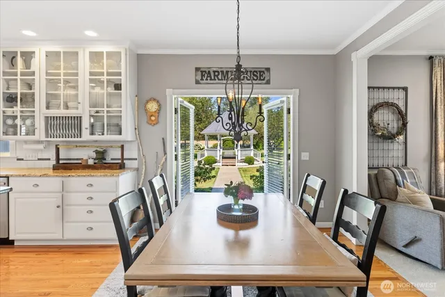 a view of a dining room with furniture window and outside view