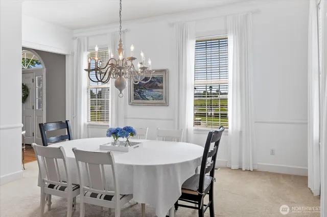 a dining room with furniture and window