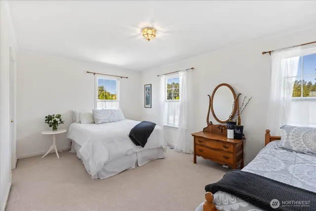 a bedroom with furniture and a window