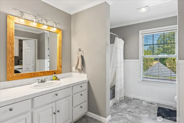 a bathroom with a sink and a mirror