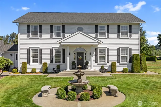 a front view of a house with a yard fire pit