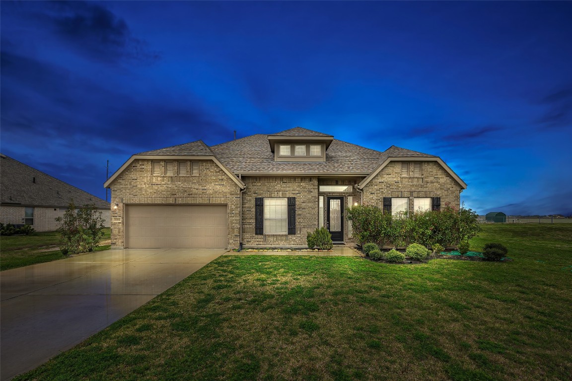 11202 Seguin Trail Needville, TX 77461 - Photo 1 of 31 a front view of a house with garden