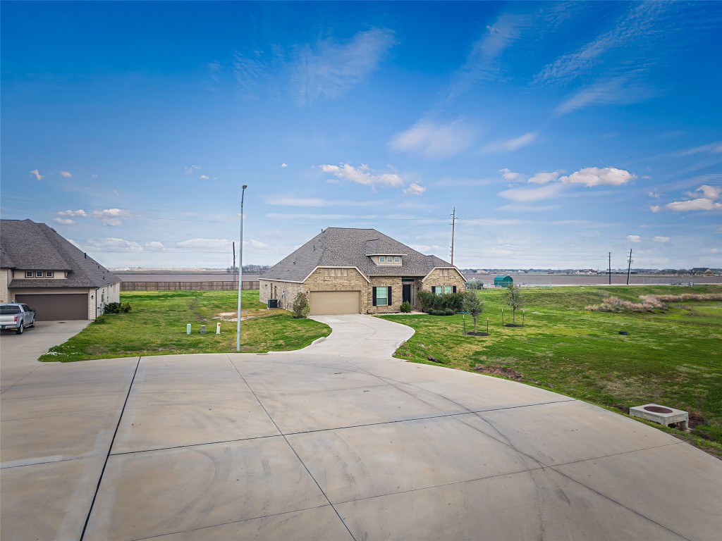 11202 Seguin Trail Needville, TX 77461 - Photo 26 of 31 a front view of a house with garden