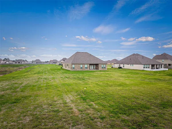 a view of a house with a big yard